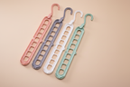 Four hangers on premium beige background
