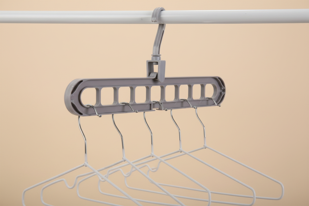 Grey hanger with silver hangers on premium beige background