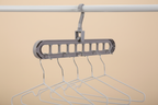Grey hanger with silver hangers on premium beige background
